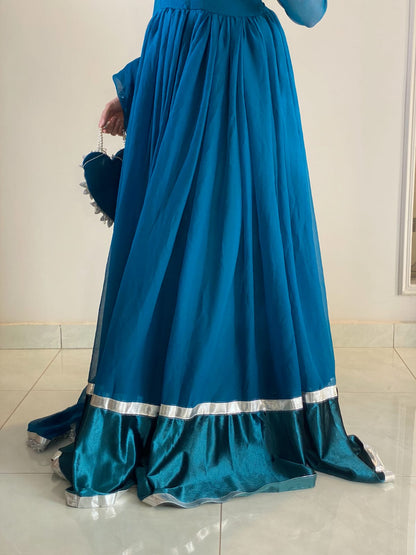 Zoya - Embroidered Chiffon Anarkali Set with Potli Bag in Teal Blue by SEHZA