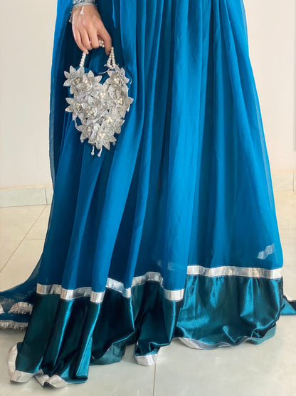 Zoya - Embroidered Chiffon Anarkali Set with Potli Bag in Teal Blue by SEHZA
